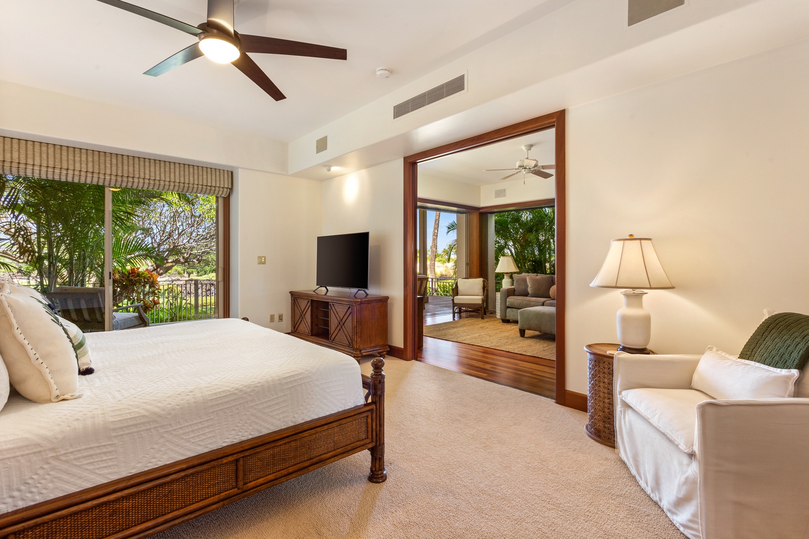 Kailua Kona Vacation Rentals, OFB 3BD Ka'Ulu Villa (129D) at Four Seasons Resort at Hualalai - Alternate view of primary suite showcasing arm chair and doorway to “bonus living room”.