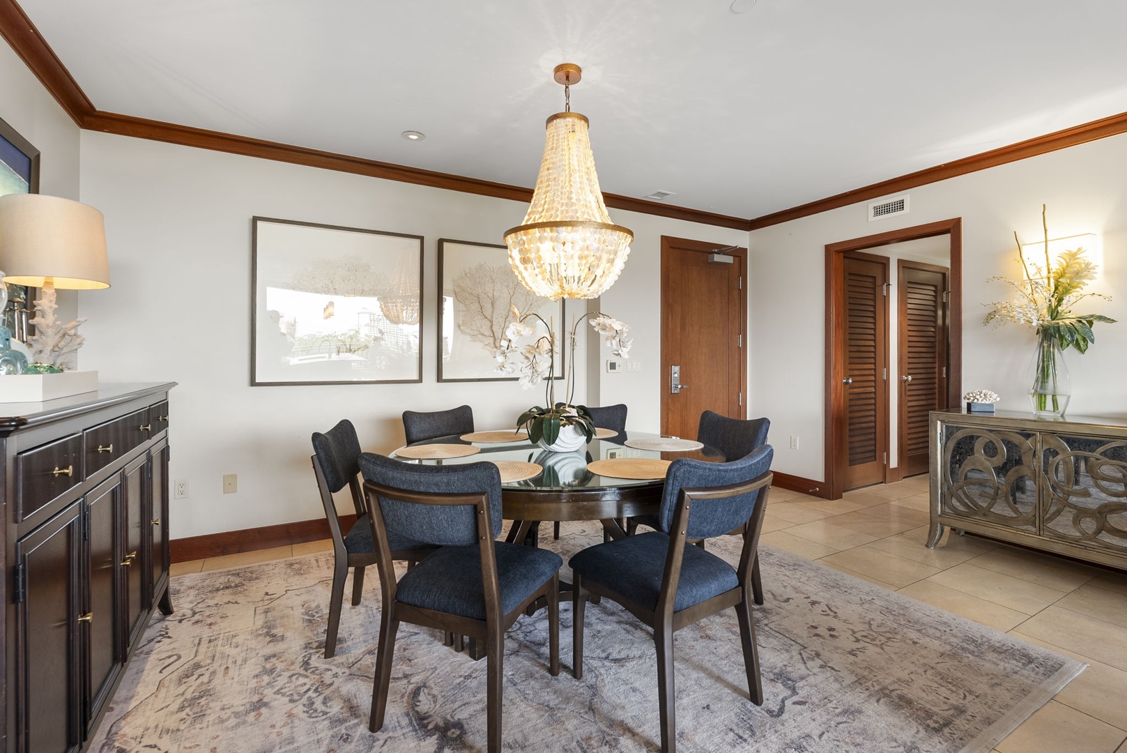 Kapolei Vacation Rentals, Ko Olina Beach Villas B604 - Gather around your elegant dining table under the stunning chandelier for memorable meals with loved ones.