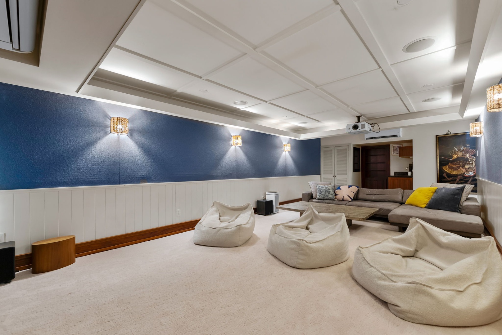 Kailua Vacation Rentals, Leaf House - Cozy and plush bean bags or stretch out on the sectional in your private home theater. Perfect for movie nights and game days.