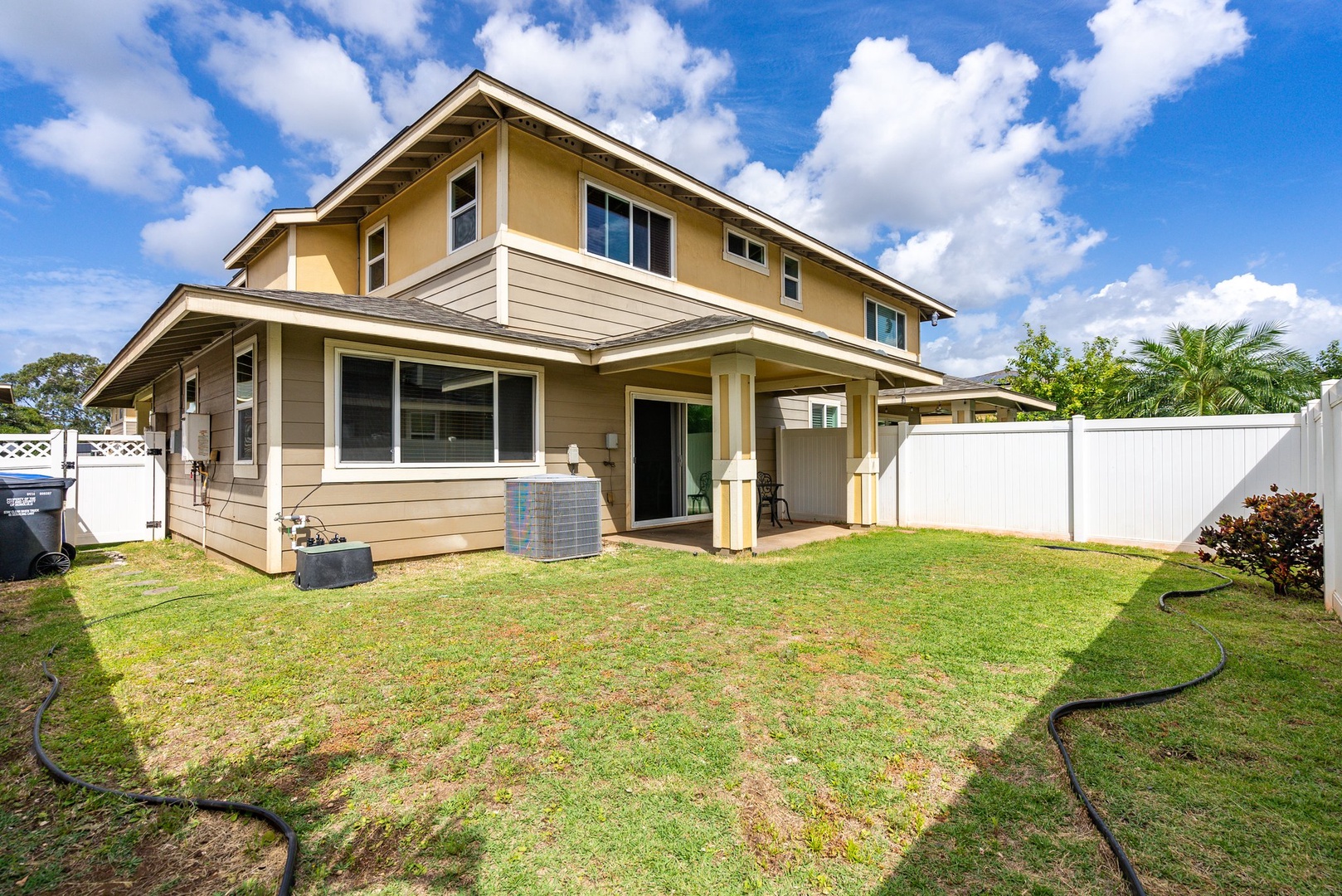 Kapolei Vacation Rentals, Kilipue Retreat - Fenced backyard with covered lanai, perfect for grilling and letting kids or pets play safely.