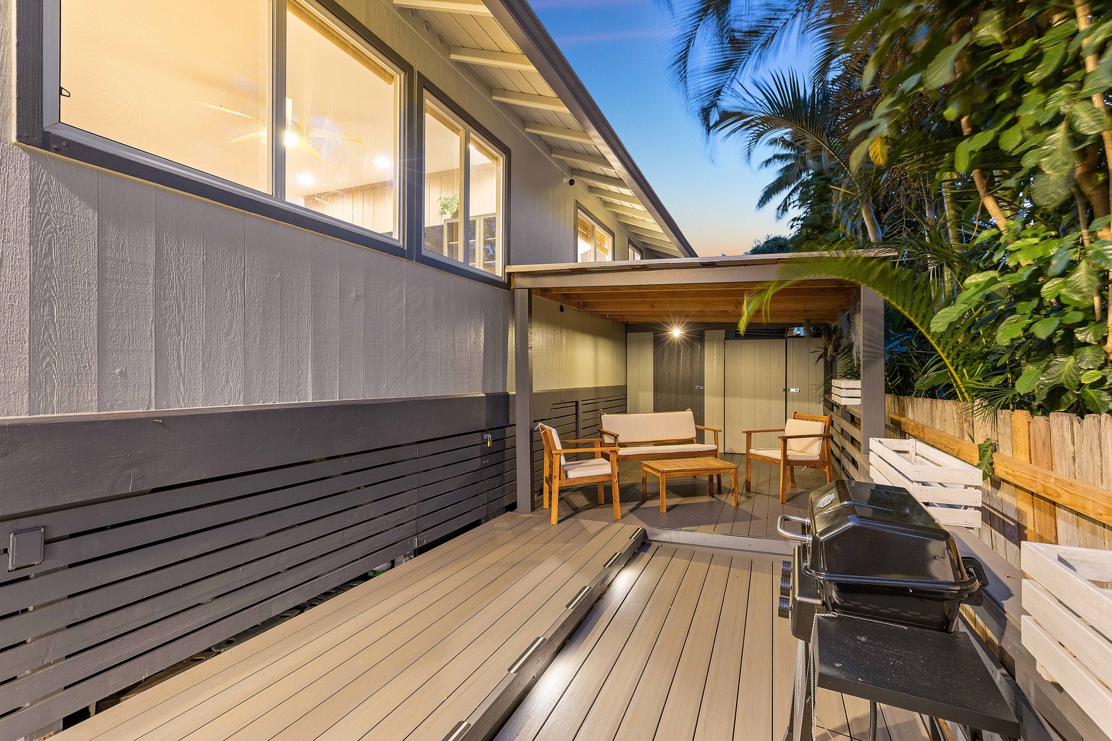 Haleiwa Vacation Rentals, Velzey Villa (3B Vacation Home) - Evening ambiance on the outdoor deck, perfect for dining or lounging under the stars.