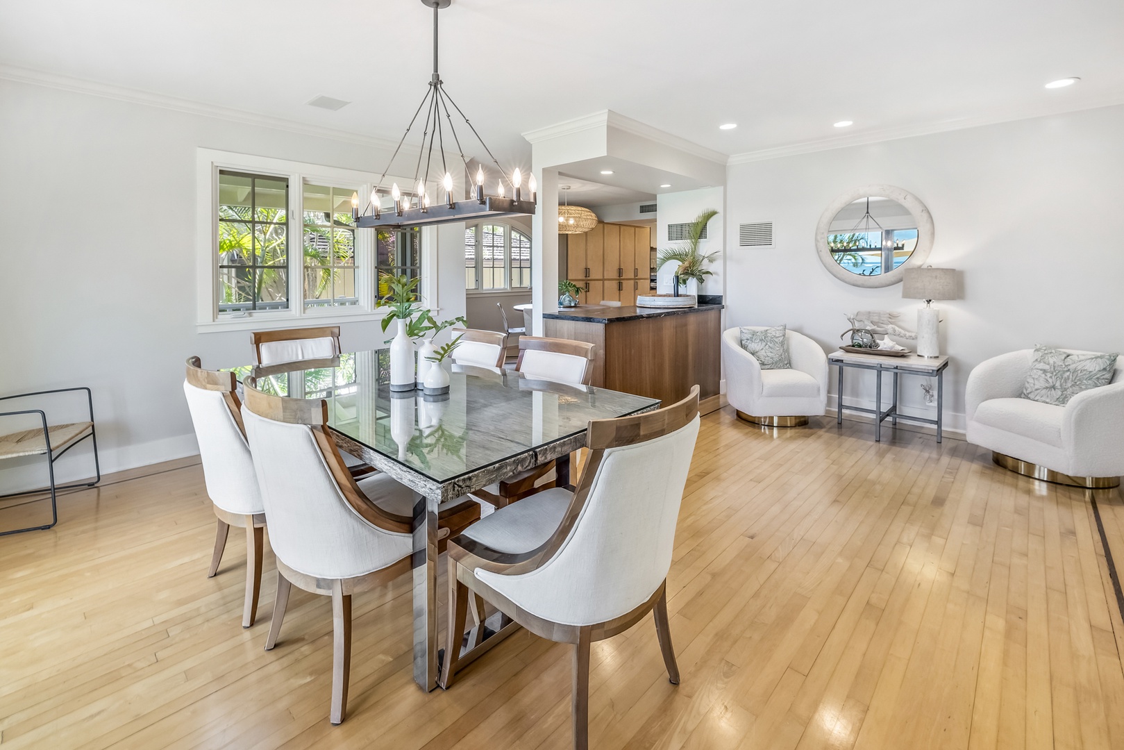 Honolulu Vacation Rentals, Moana Lani - Main House - Dinner for the whole group at a long table under the dining room chandelier.