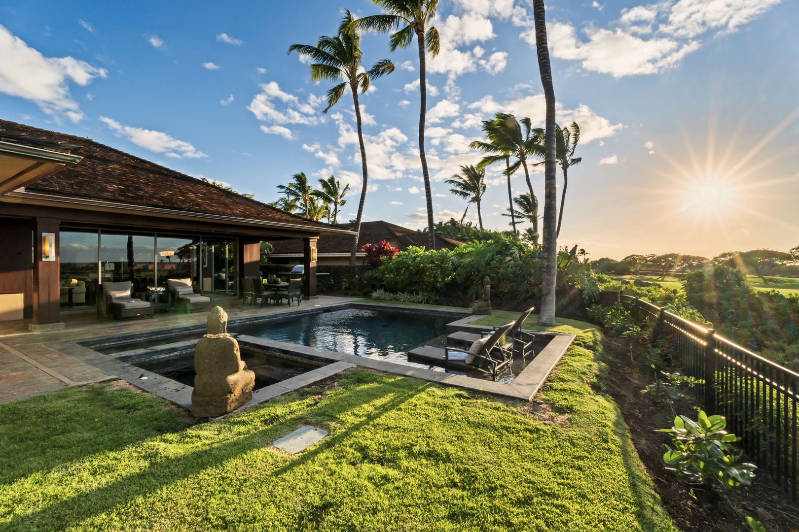Kailua Kona Vacation Rentals, 3BD Pakui Street Estate (149) at Hualalai Resort - The last light of the day pours across the lawn and the pool, right on cue.