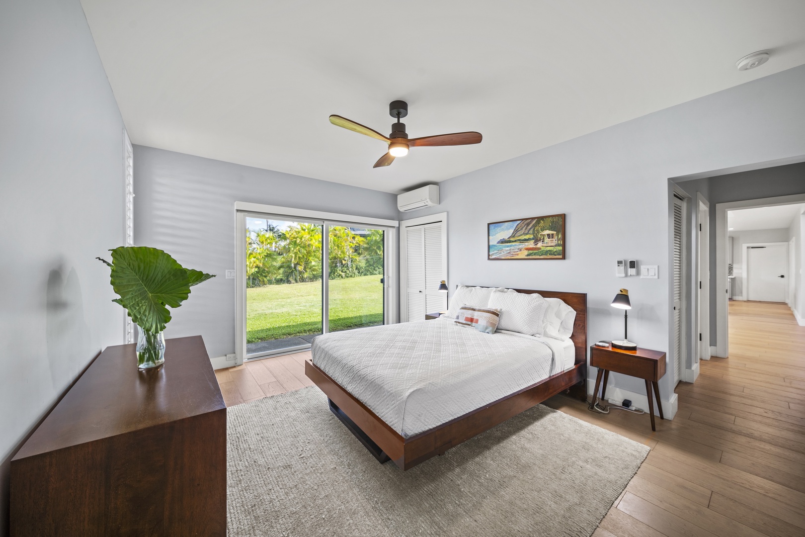 Haleiwa Vacation Rentals, Hale Mahina - Open the doors to lush garden views from this inviting bedroom with indoor-outdoor flow.