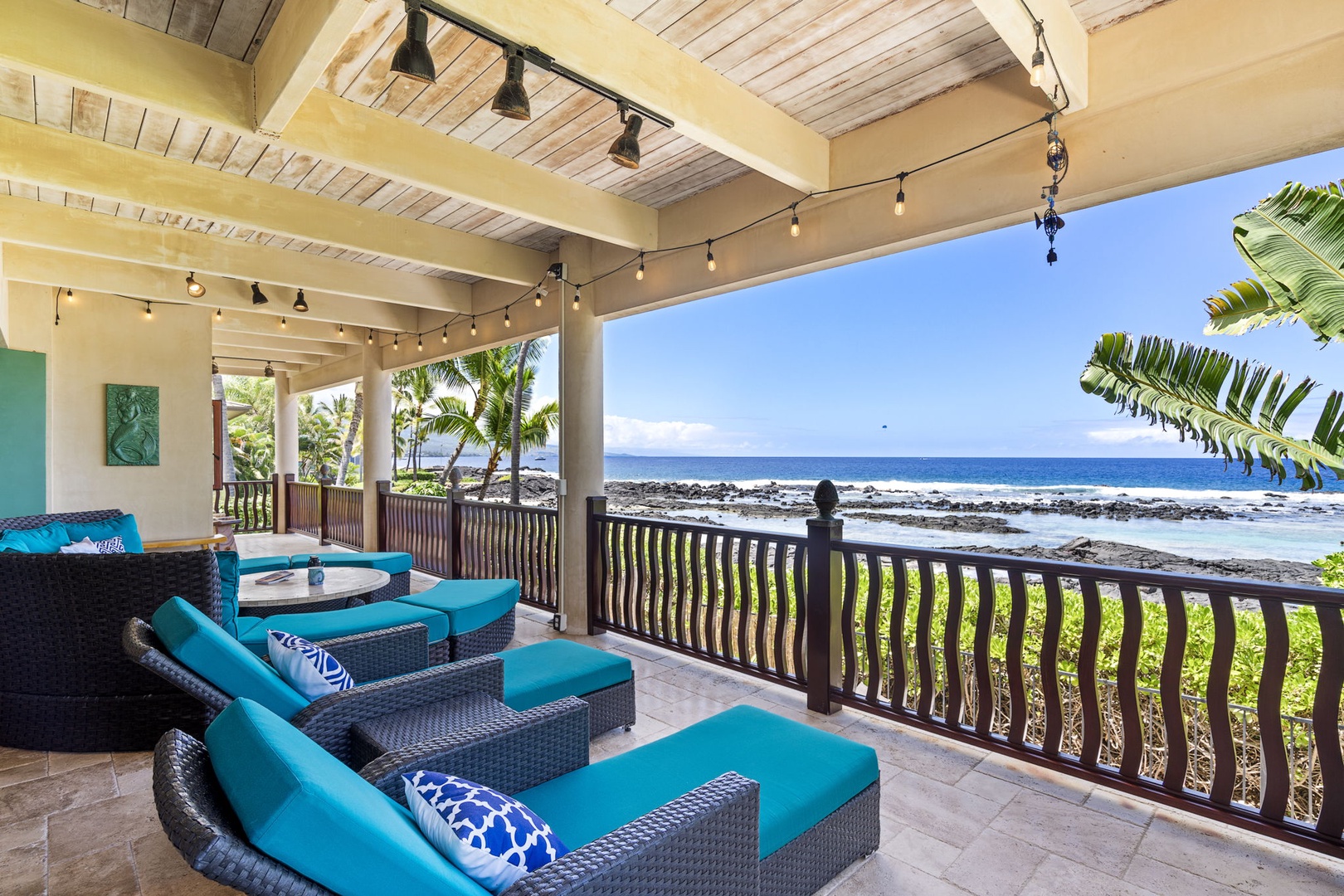 Kailua Kona Vacation Rentals, Mermaid Cove - String lights and sectional seating frame a perfect sunset scene—ideal for evening relaxation
