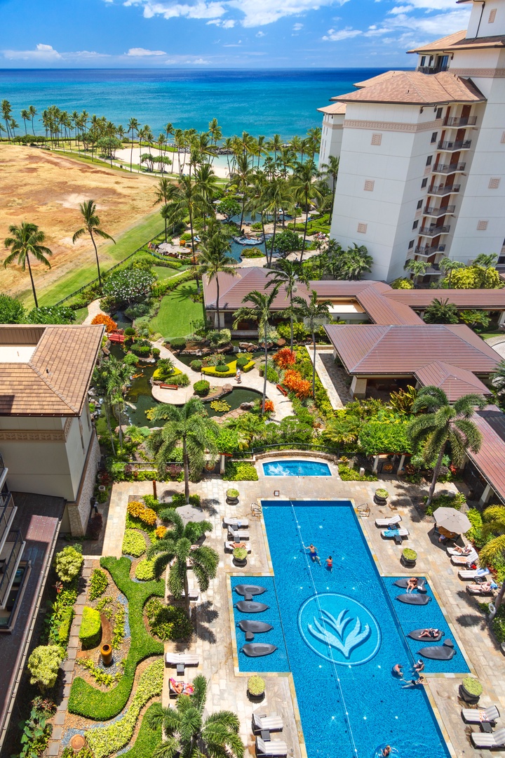 Kapolei Vacation Rentals, Ko Olina Beach Villas O1105 - Aerial view of the pool with sun loungers.