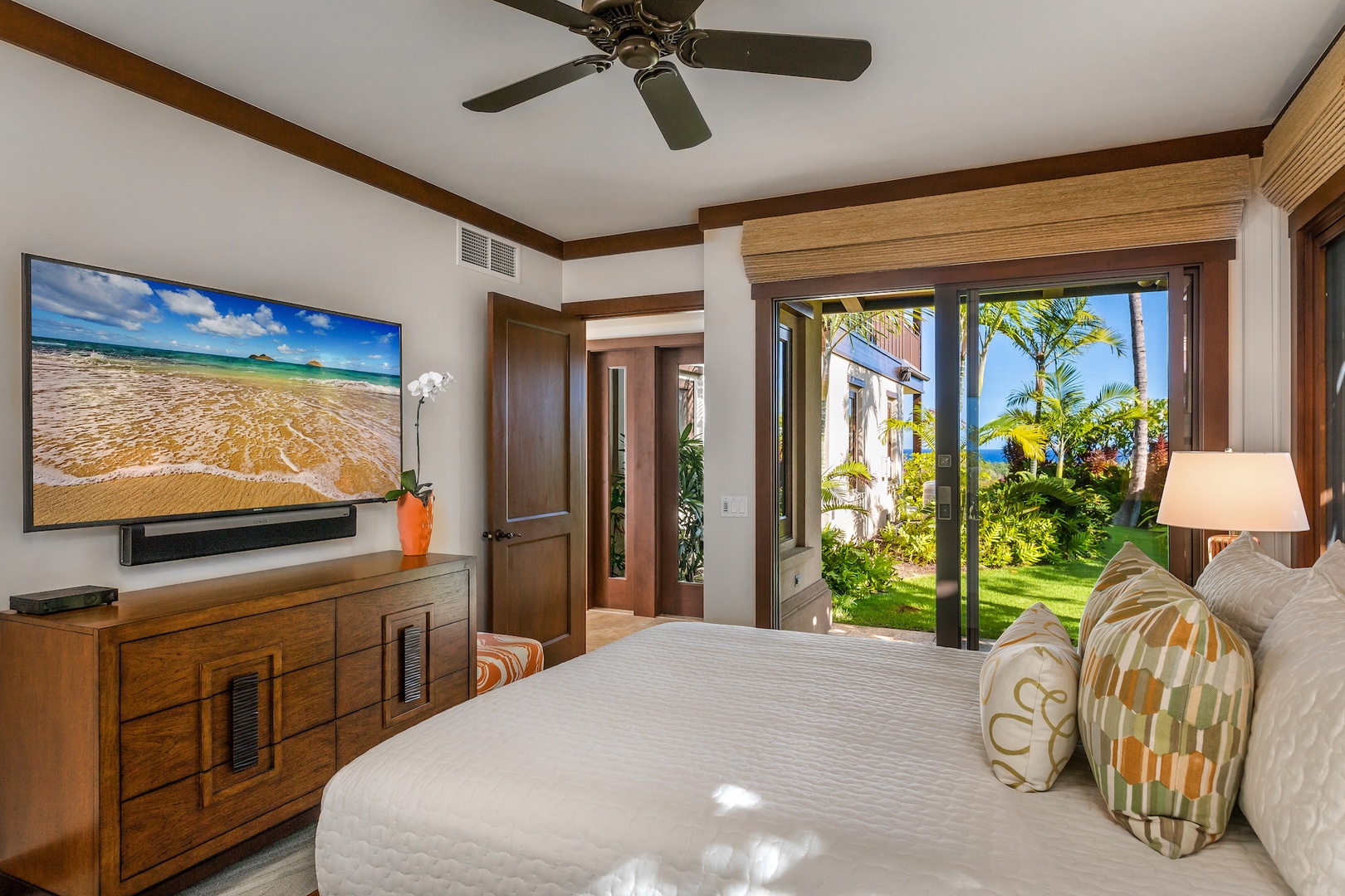Kailua Kona Vacation Rentals, 2BD Hali'ipua Villa (108) at Four Seasons Resort at Hualalai - Second bedroom with queen-sized bed, 65" flat-screen TV, ensuite bath and sliding doors to a private furnished lanai.