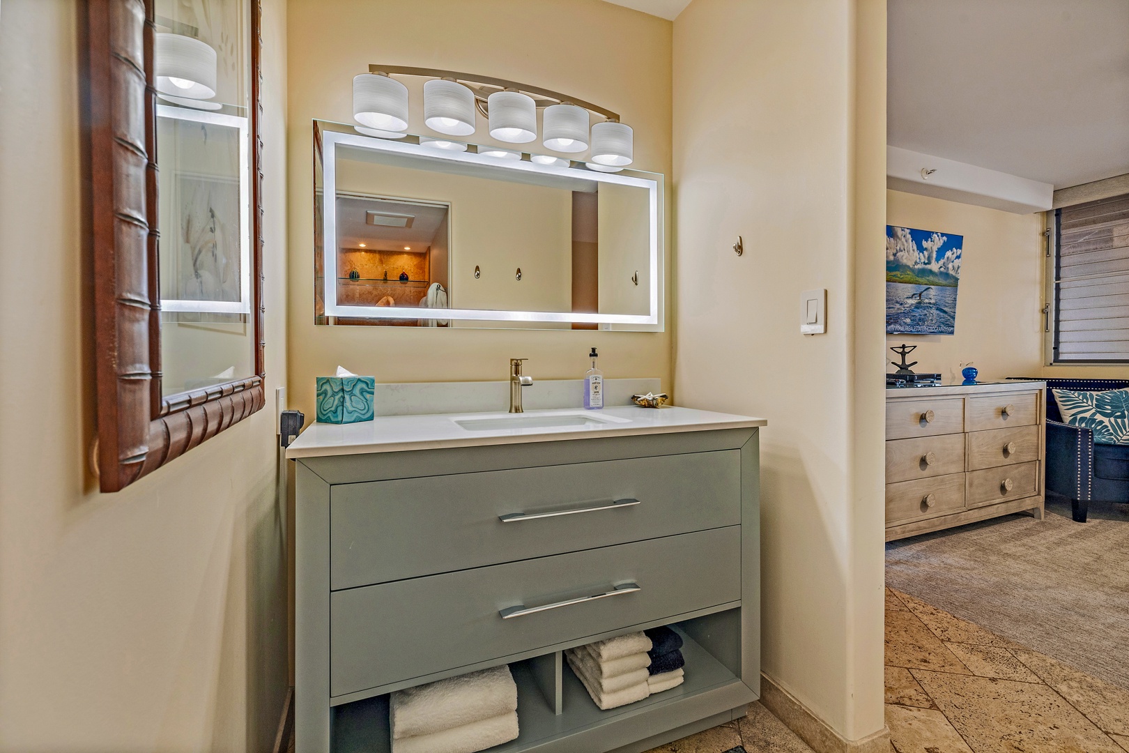 Lahaina Vacation Rentals, Royal Kahana 610 - The guest bathroom at Royal Kahana 610 offers a sleek, modern vanity with ample counter space and storage for your convenience.