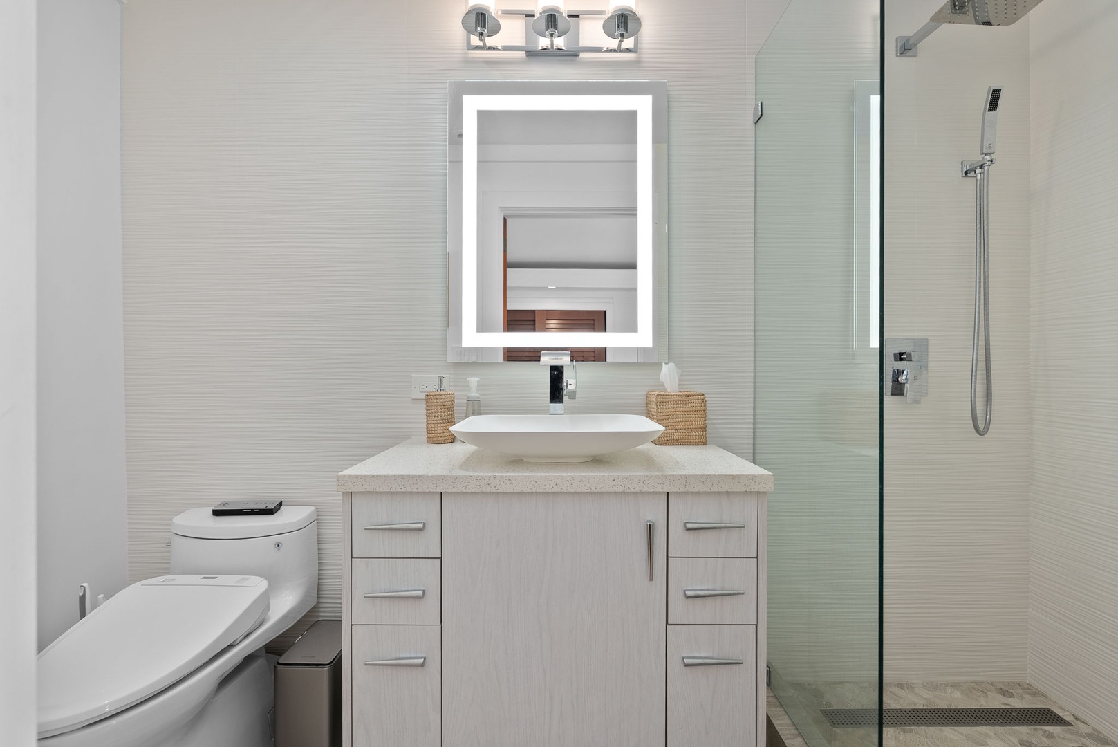 Honolulu Vacation Rentals, The Lagoon House 3BR - Bathroom with vessel sink, illuminated mirror, and glass shower for a fresh start.