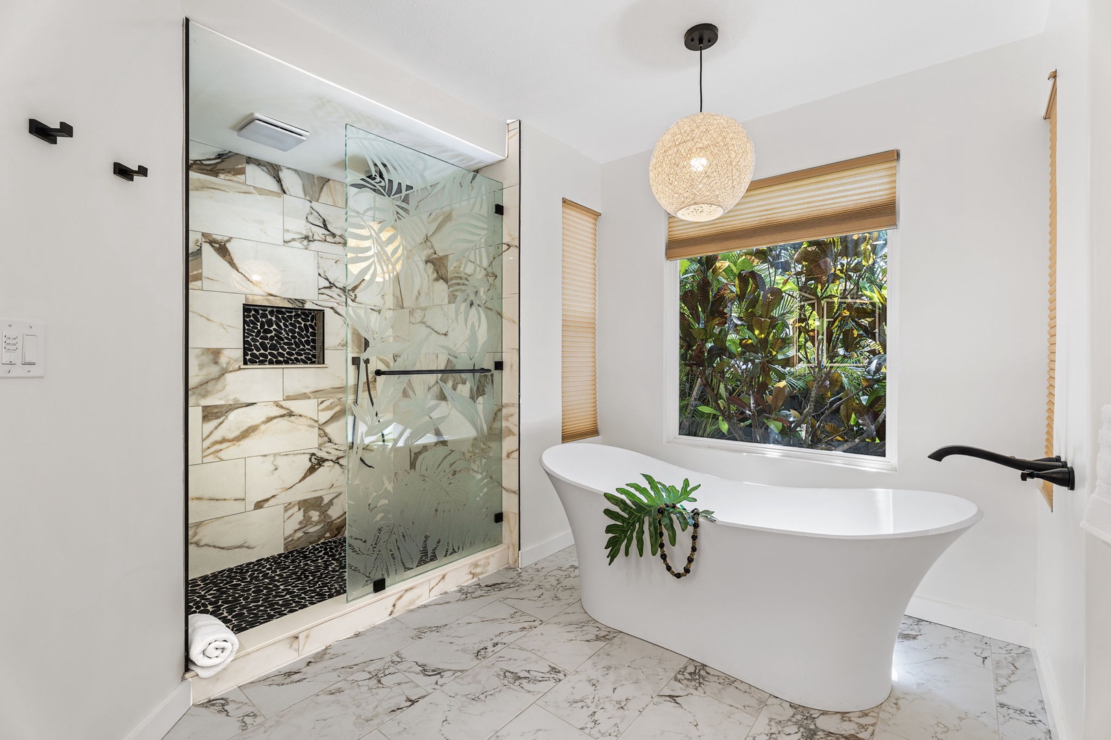 Kailua-Kona Vacation Rentals, Honu Hale - Indulge in your own spa sanctuary with a luxurious soaking tub and rainfall shower, surrounded by elegant marble and tropical garden views.