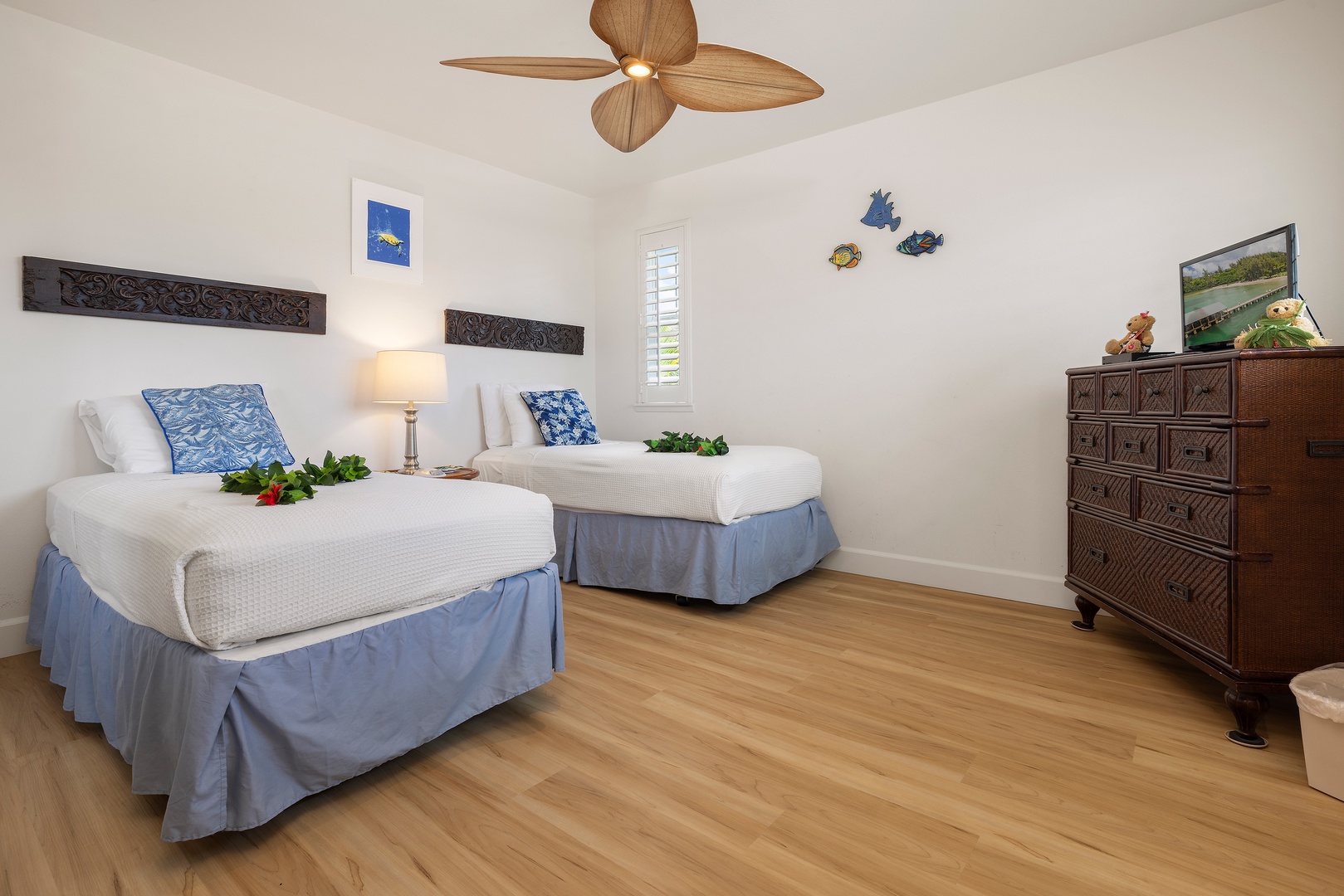 Kapolei Vacation Rentals, Ko Olina Kai 1105E - Unwind in your tropical twin bedroom with plush linens, ocean-themed decor, and a gentle ceiling fan to keep you cool and comfortable.