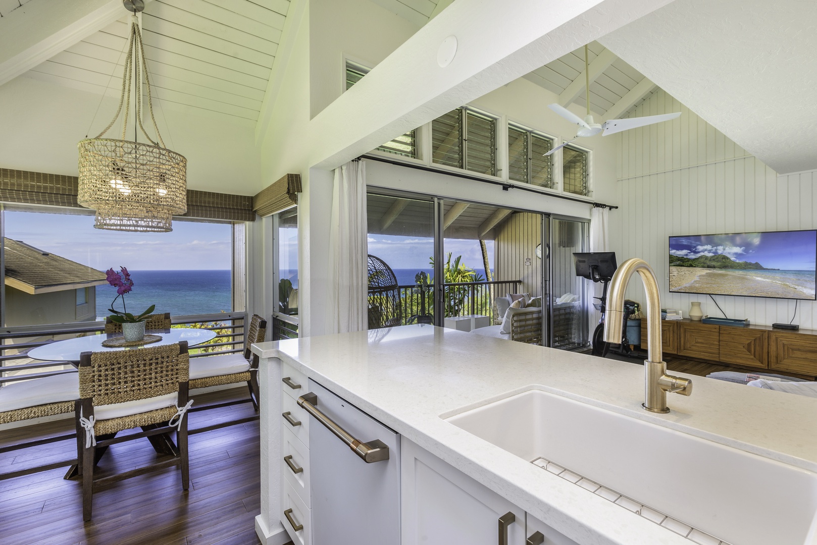 Princeville Vacation Rentals, Pali Ke Kua 207 - Get ready for breakfast! Our newly renovated galley-style kitchen is fully equipped with custom cabinets and all the appliances you need, including a dishwasher. Plus, there's a breakfast bar - so you can get your day started in no time!