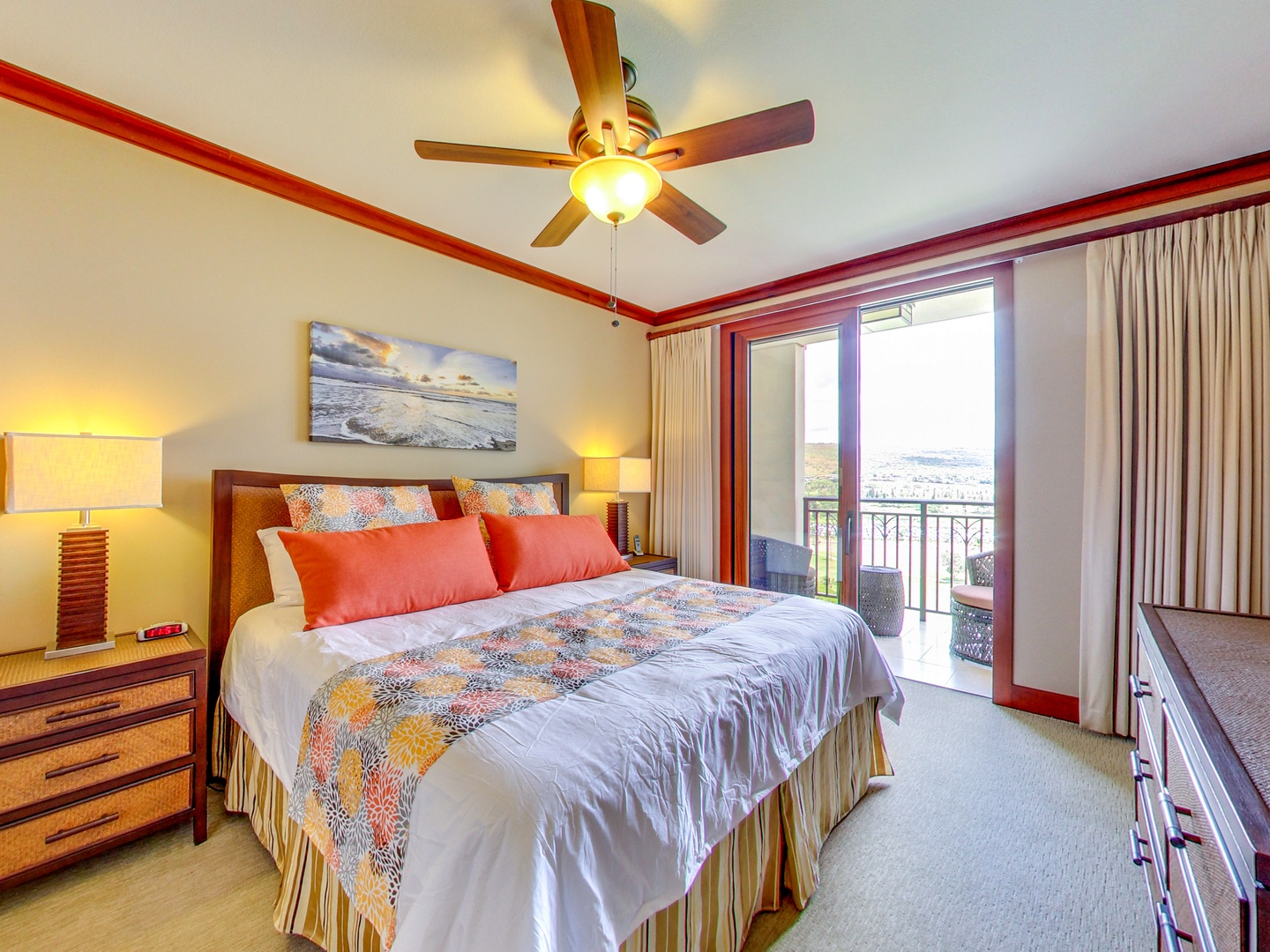 Kapolei Vacation Rentals, Ko Olina Beach Villas O1402 - The primary bedroom with lanai, ceiling fan, and captivating views.