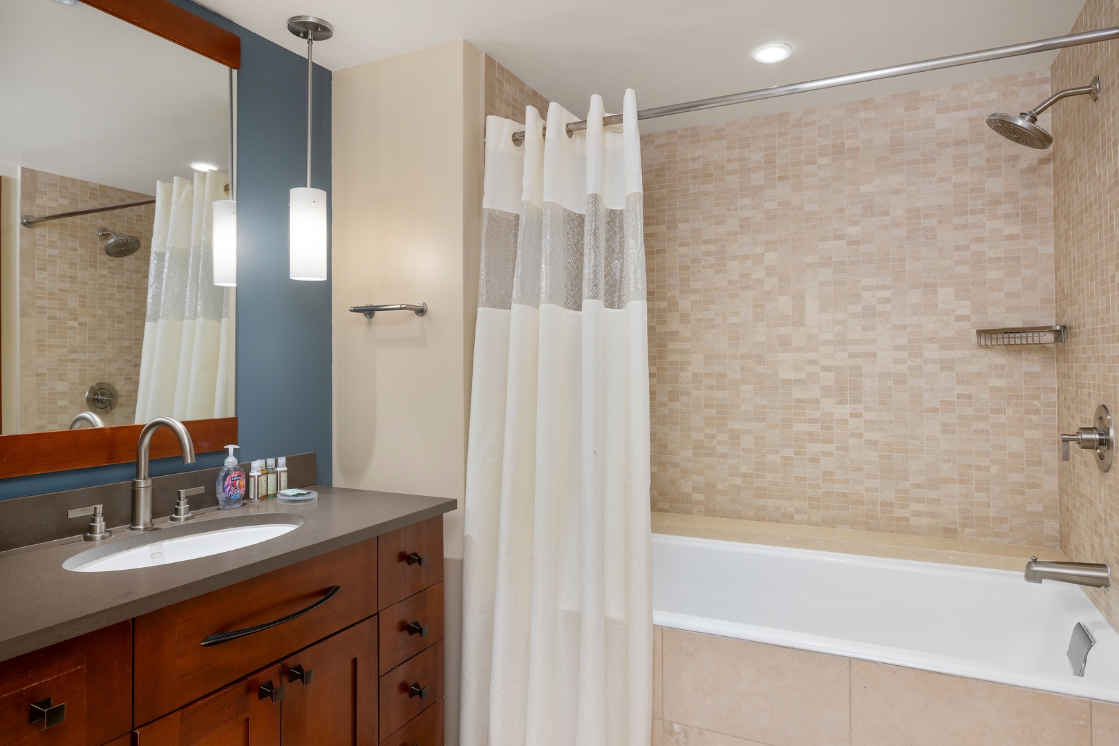 Unwind in your elegant bathroom with a deep soaking tub, refreshing shower, and modern vanity—your perfect retreat after exploring.