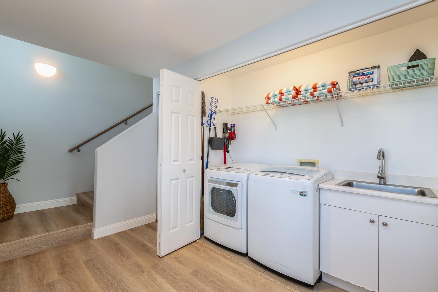 Princeville Vacation Rentals, Sea Glass - The spacious laundry room with a washer and a dryer.