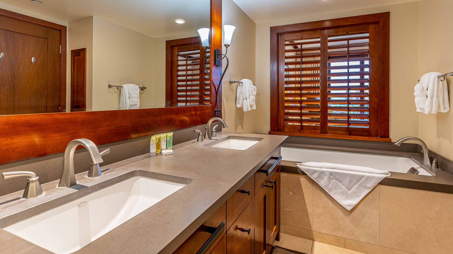 Kapolei Vacation Rentals, Ko Olina Beach Villas B706 - The primary guest bathroom with a double vanity and a large soaking tub where you can relax your cares away.
