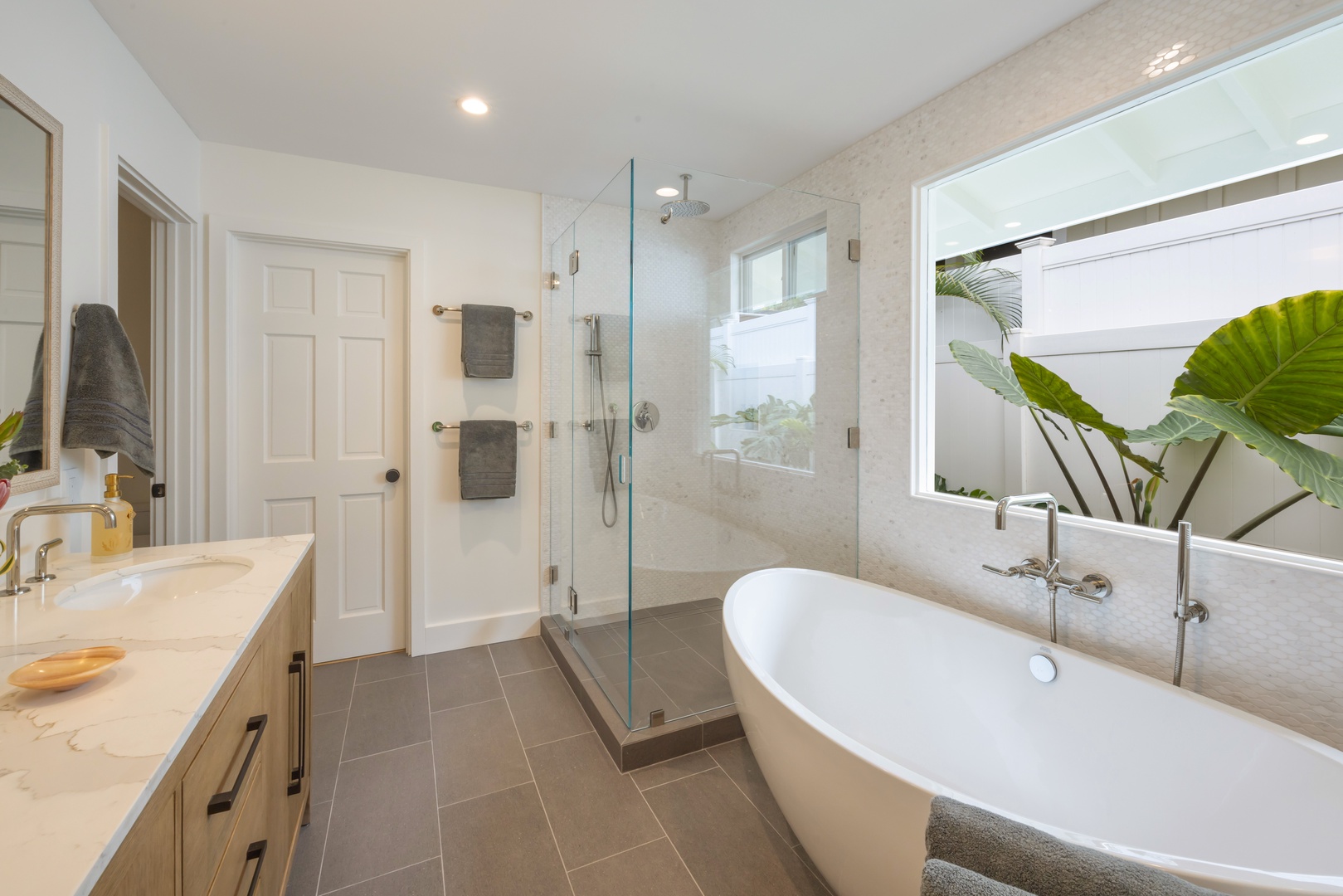 Kailua Vacation Rentals, Lanikai Ola Nani - Indulge in the ensuite bath, featuring a freestanding soaking tub, walk-in rain shower, and peaceful garden-facing views.