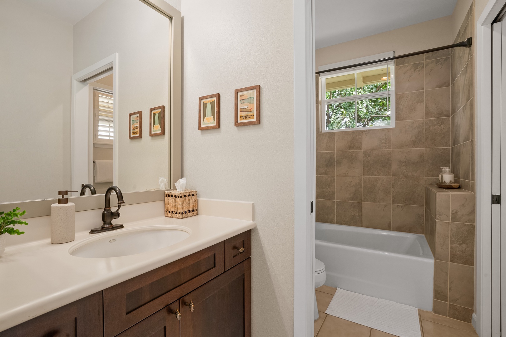 Princeville Vacation Rentals, Hale Kaua'i - Start and end your day in this spacious bathroom with warm finishes and a soothing atmosphere.