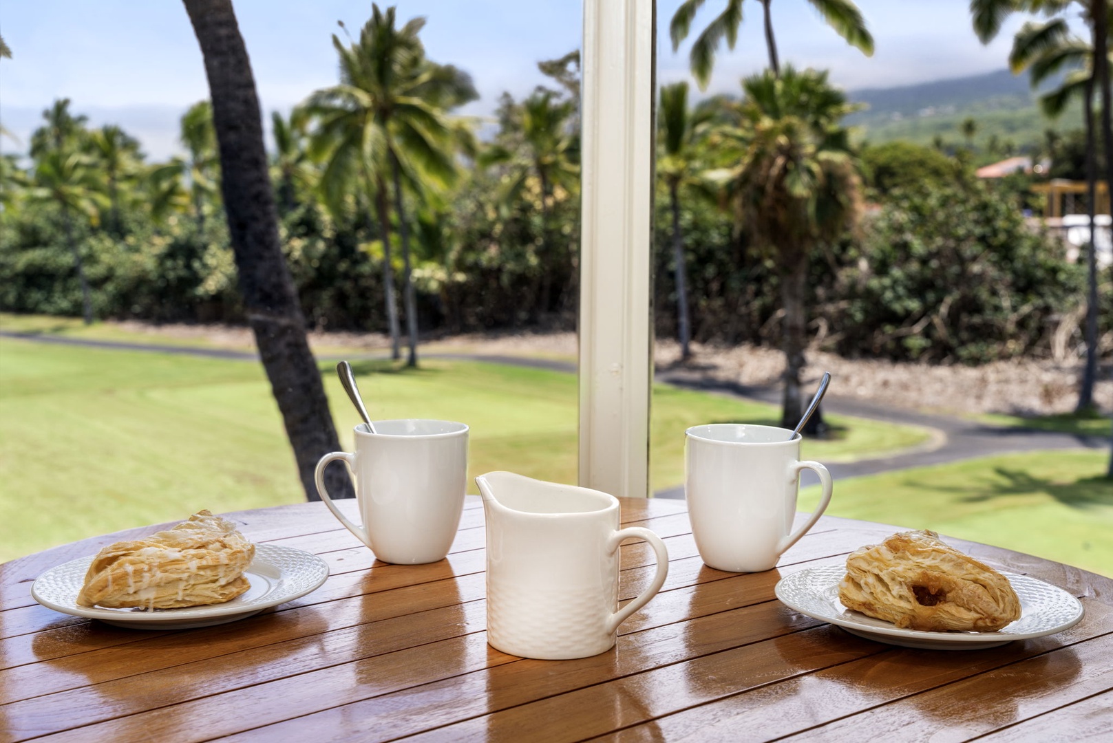 Kailua Kona Vacation Rentals, Kanaloa at Kona 1606 - Morning coffee and something sweet, the fairway greening up past the rail.