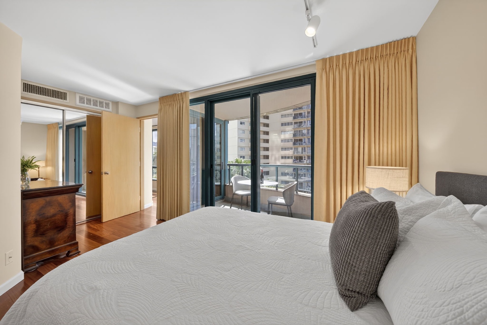 Honolulu Vacation Rentals, Island View at Waikiki Landmark - Retreat to this peaceful bedroom with floor-to-ceiling windows and private lanai access.