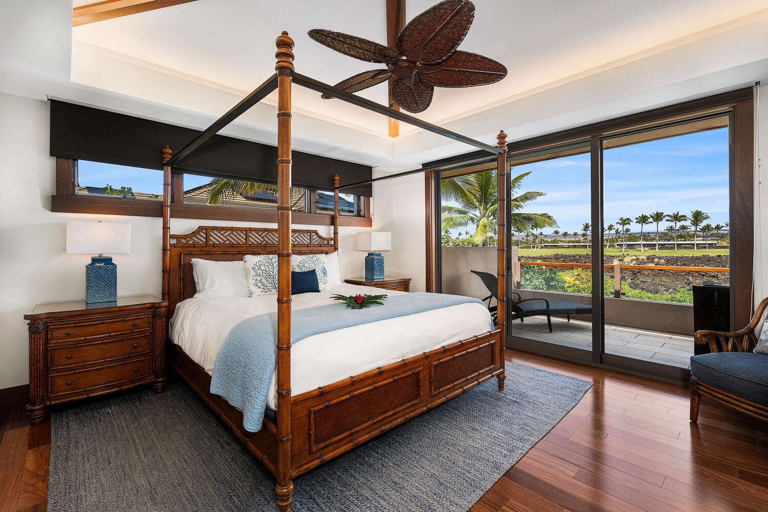 Kamuela Vacation Rentals, Laule'a Ohana Retreat - Primary suite with king bed, TV, custom canopy frame, and private lanai access at Laule'a #13.