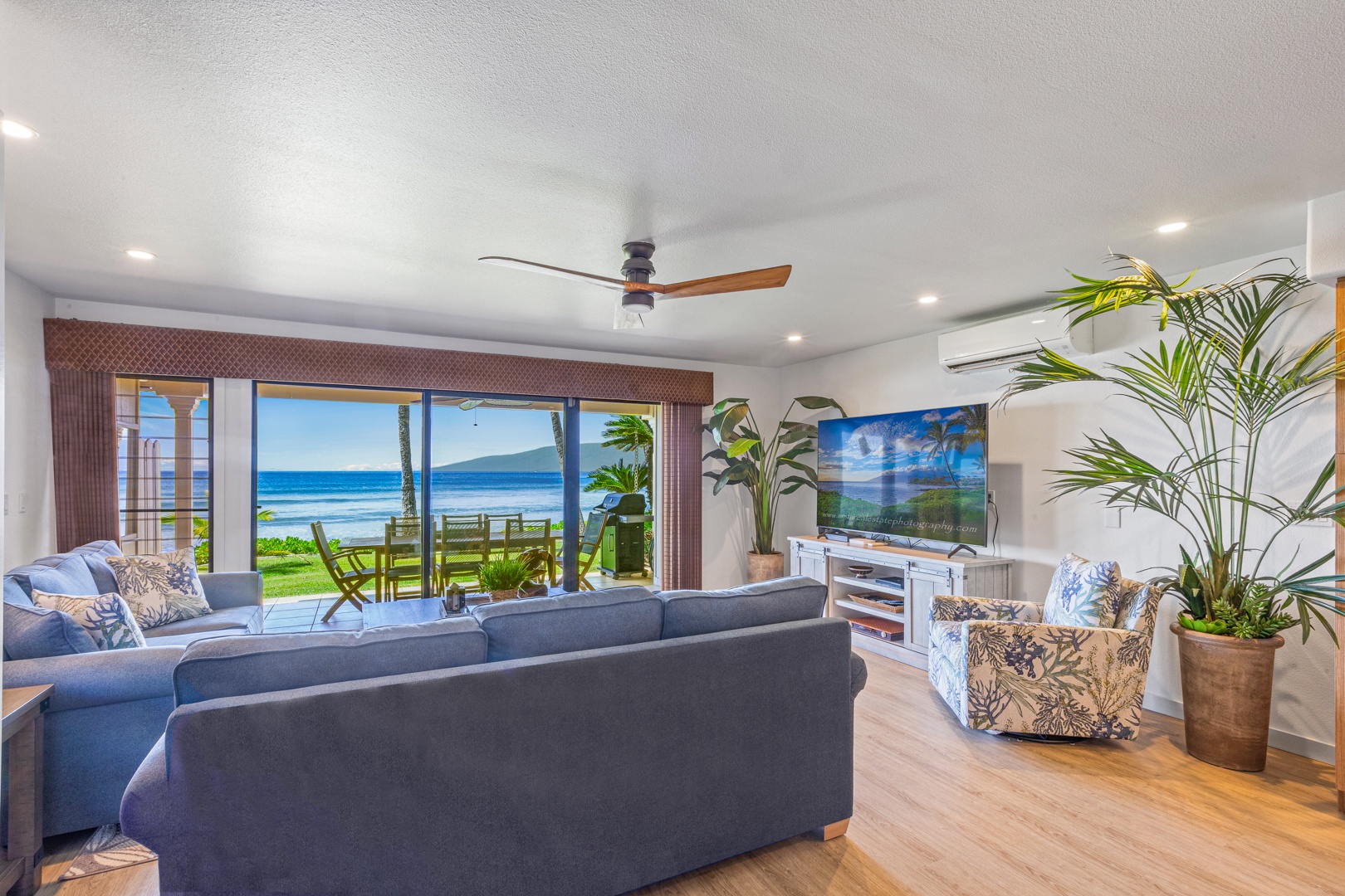 Lahaina Vacation Rentals, Puamana 254-2 - Lounge in the open living area looking to the lanai with stunning ocean views.