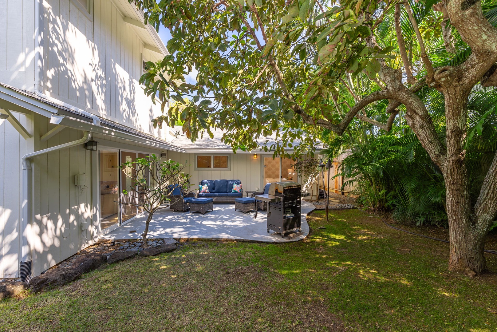 Kailua Vacation Rentals, Nohie Lanikai - A spacious patio with a BBQ grill and ample seating, ideal for outdoor dining.