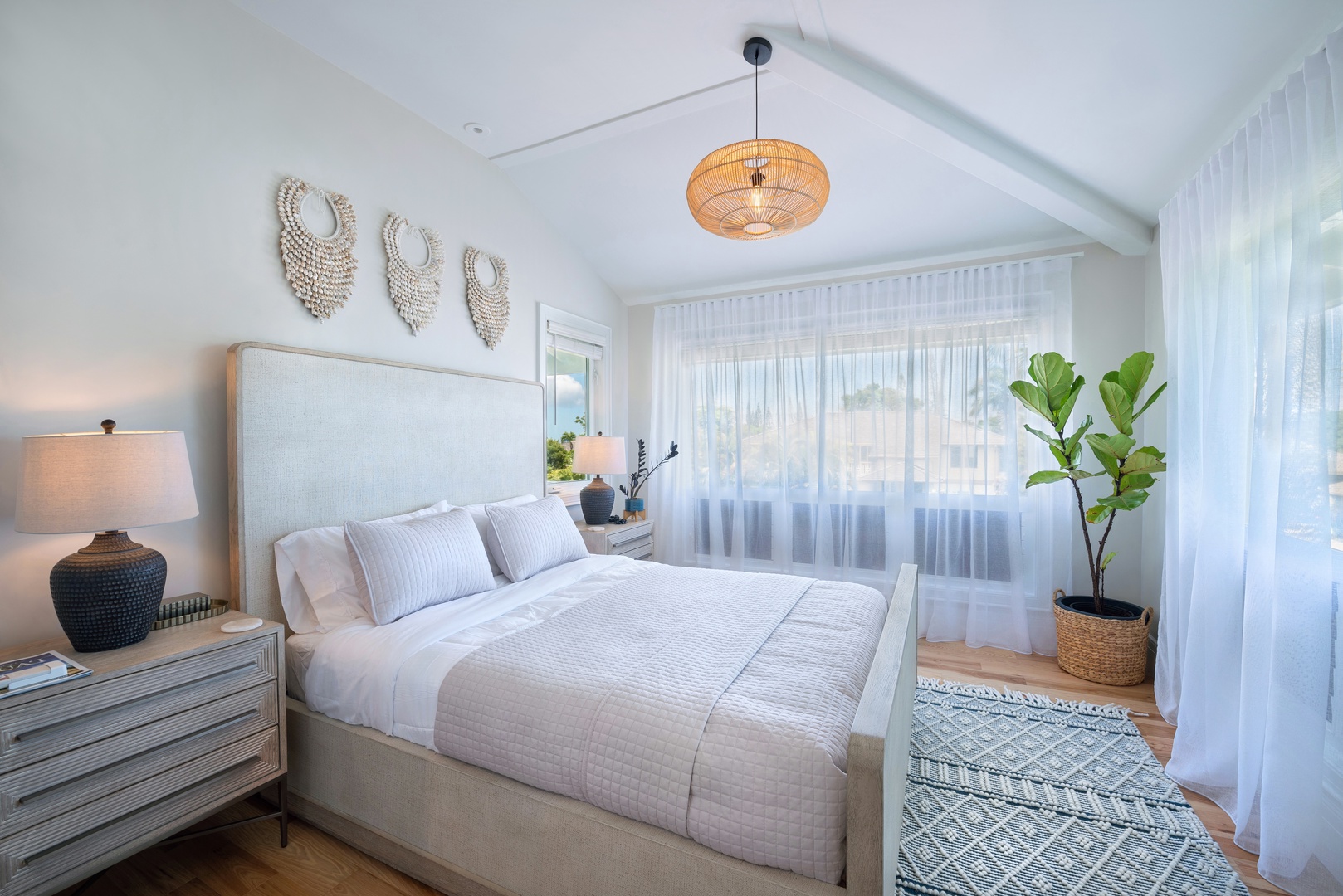 Princeville Vacation Rentals, Hihimanu House - Bright and airy guest bedroom with a cozy queen-size bed, soft tones, and plenty of natural light.