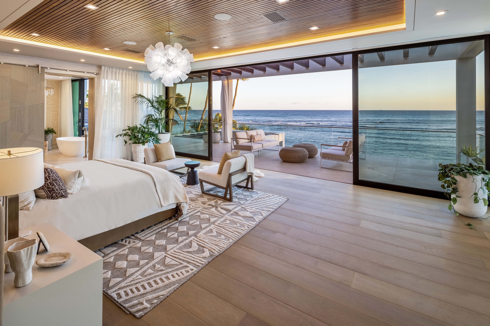 Honolulu Vacation Rentals, Diamond Head Grand Escape - Wake up to breathtaking Pacific views from the primary bedroom, complete with a private lanai and seating.