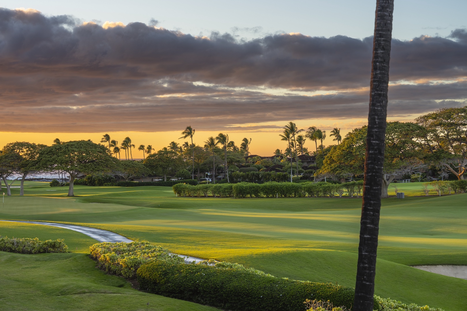 Kailua Kona Vacation Rentals, 3BD Palm Villa (130B) at Hualalai Resort - Stunning sunset views over pristine golf greens surrounded by swaying palms and tropical landscaping create the perfect Hawaiian paradise setting.