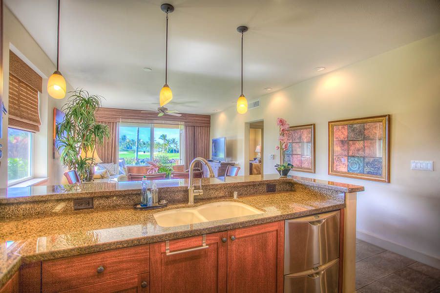 Waikoloa Vacation Rentals, Hali'i Kai 12E - Gourmet kitchen with plenty of views while preparing a meal.