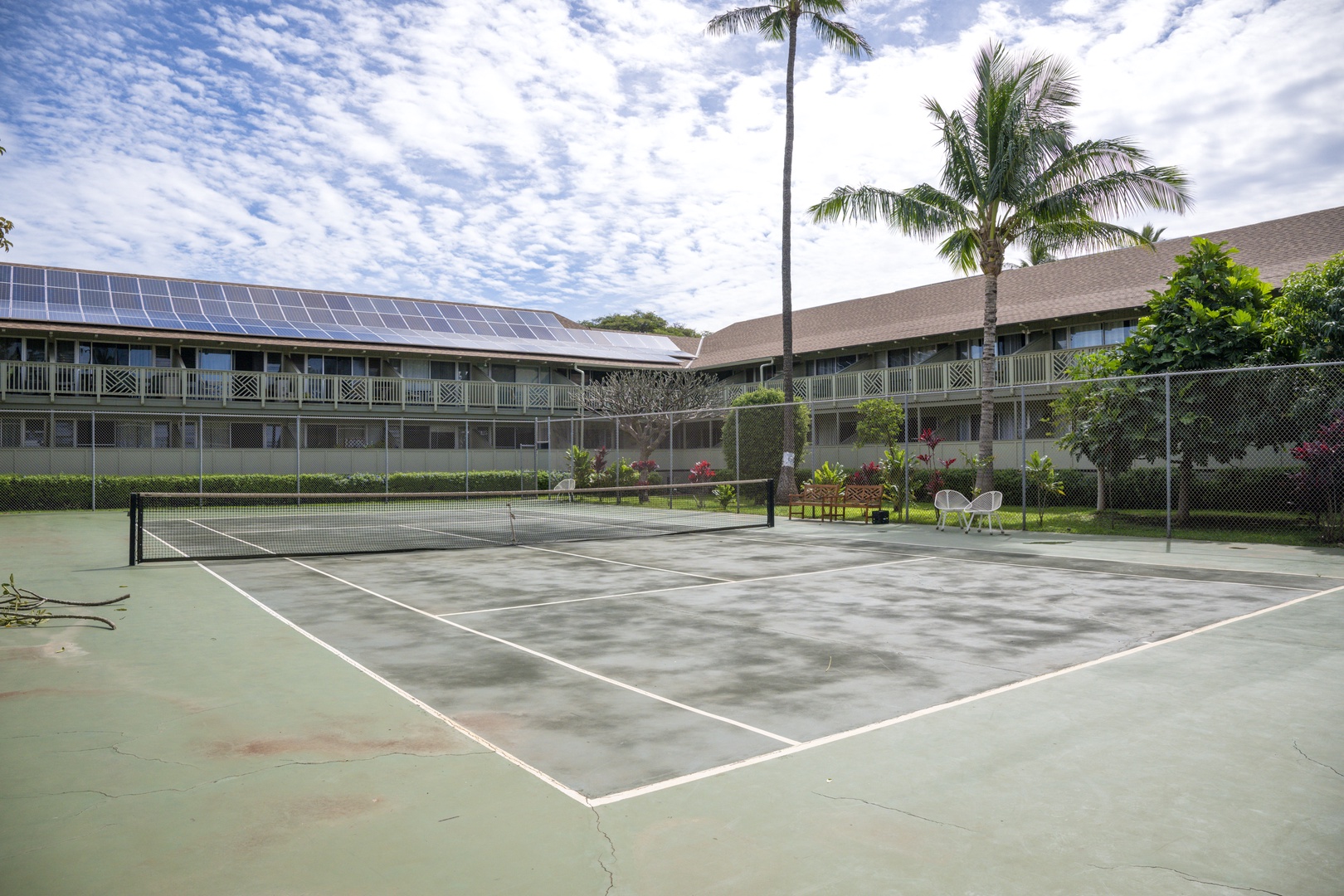 Kihei Vacation Rentals, Kihei Bay Surf B212 - Tennis court surrounded by tropical landscaping creates an active recreational setting.