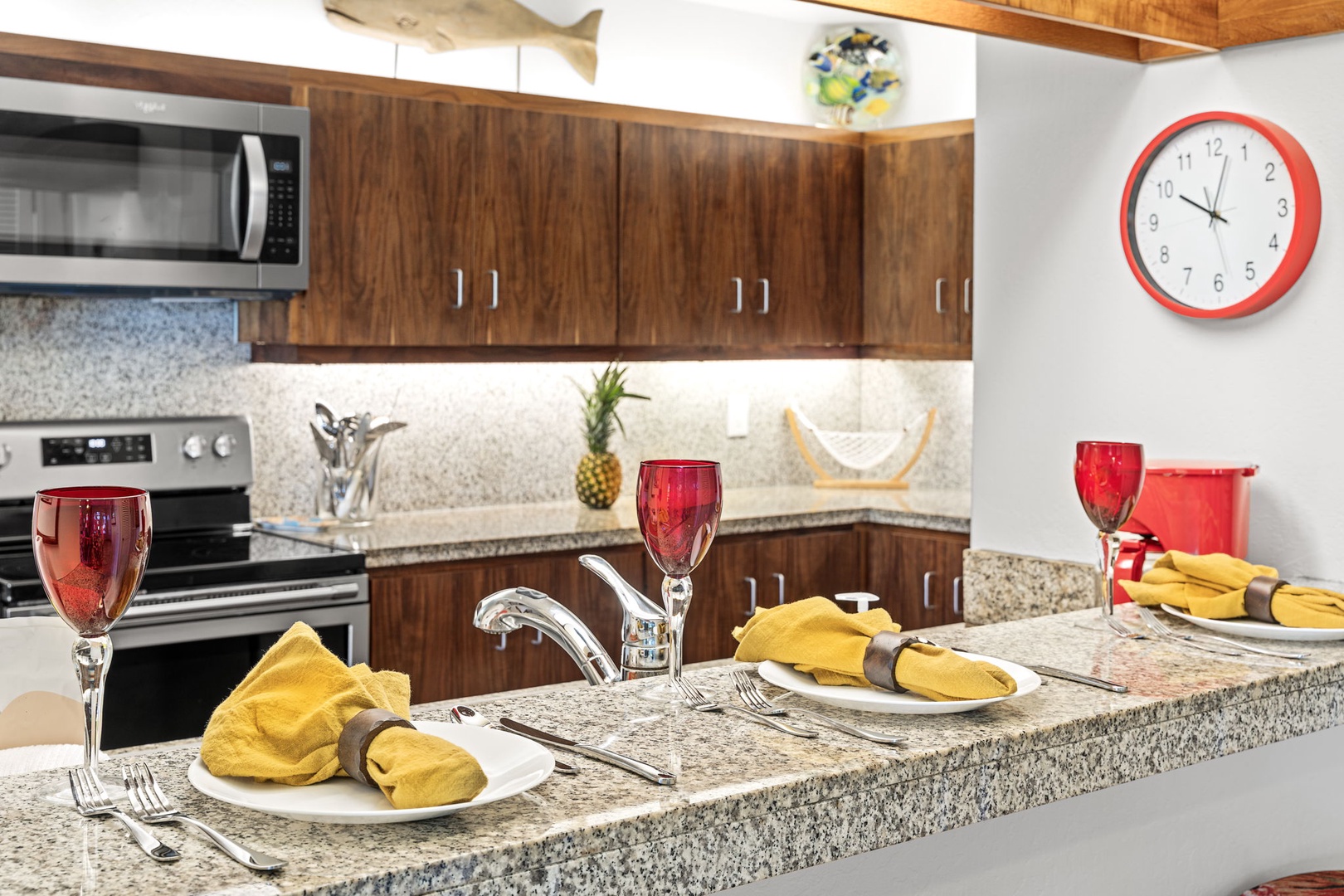 Kailua Kona Vacation Rentals, Kanaloa at Kona 701 - The fully equipped kitchen features granite counters, quality appliances, and elegant table settings for memorable meals.