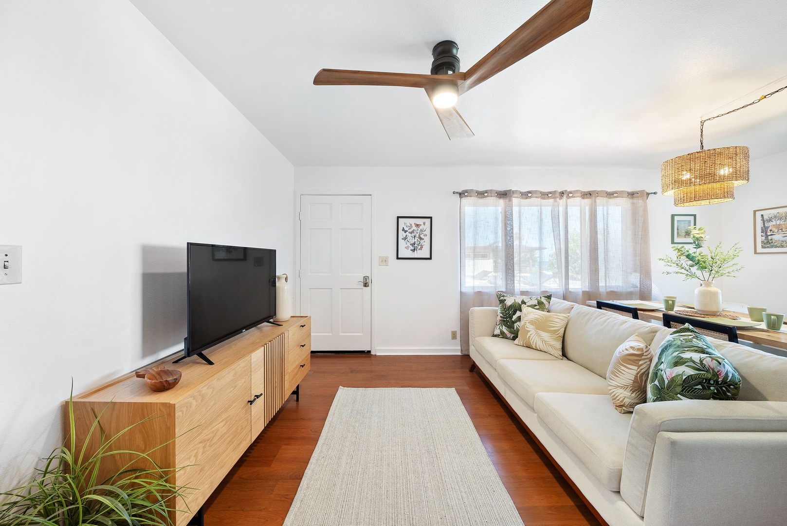 Haleiwa Vacation Rentals, Pikai Hale - The entrance of the home leads directly into the living area, equipped with a sofa, smart TV, and ceiling fan