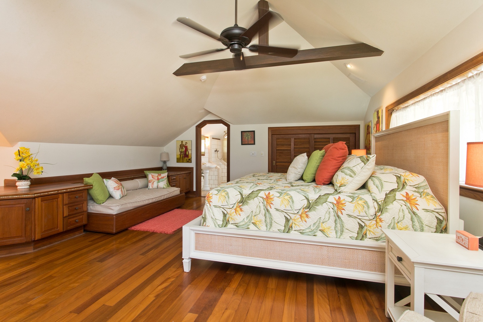 Kailua Vacation Rentals, Lanikai Village* - Hale Melia: Guest bedroom with a lounge area, fandelier and ensuite bathroom.