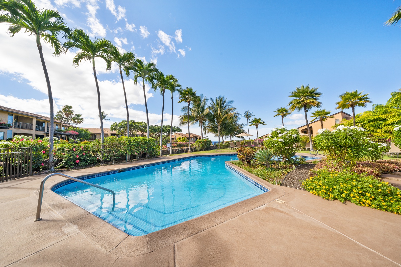 Kihei Vacation Rentals, Wailea Ekolu 1106 - Cool off at Wailea Ekolu 1106’s community pool, surrounded by tropical palms and sunshine