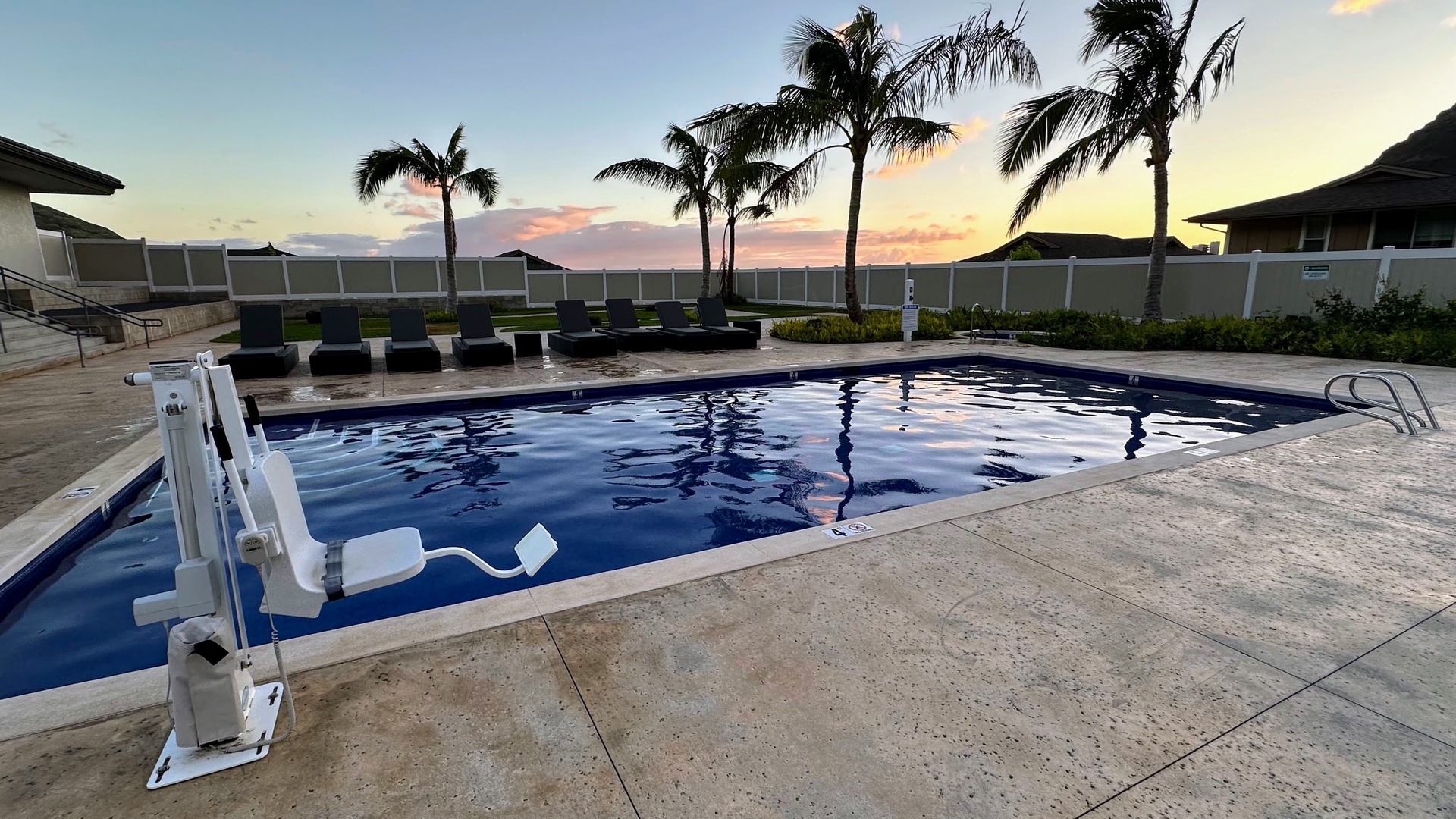 Makaha Valley Vacation Rentals, Makaha Vista Retreat** - Unwind by the palm-lined pool with sweeping views of Oahu’s west coast sunset.