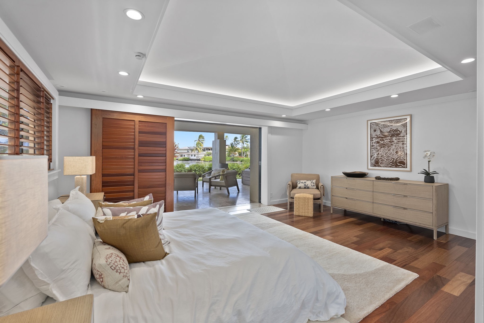 Honolulu Vacation Rentals, The Lagoon House 3BR - Light-filled bedroom with warm finishes and direct access to outdoor space.