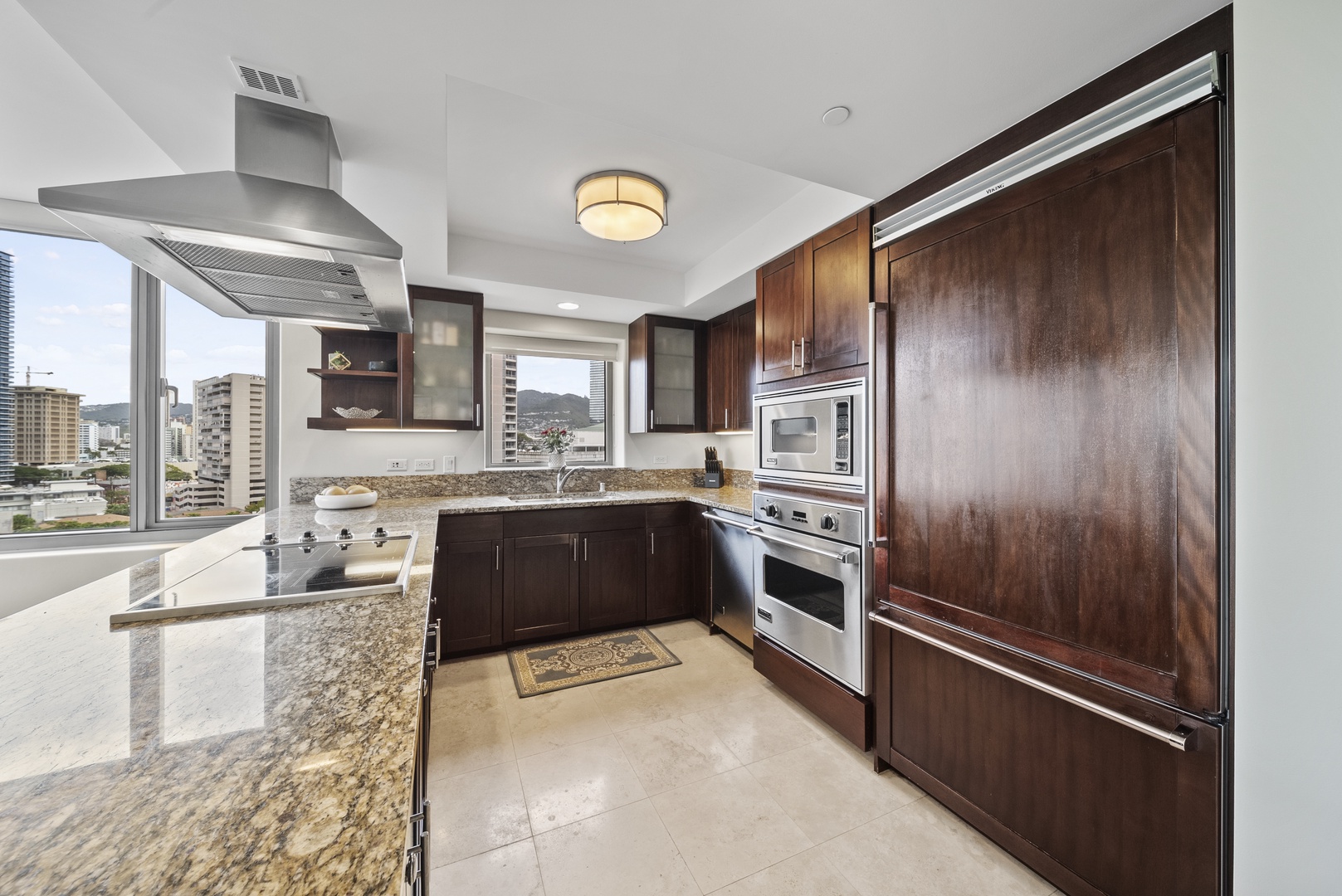 Honolulu Vacation Rentals, Watermark Waikiki Unit 901 - The modern designed kitchen has stainless steel appliances and plenty space to make meal prep convenient.