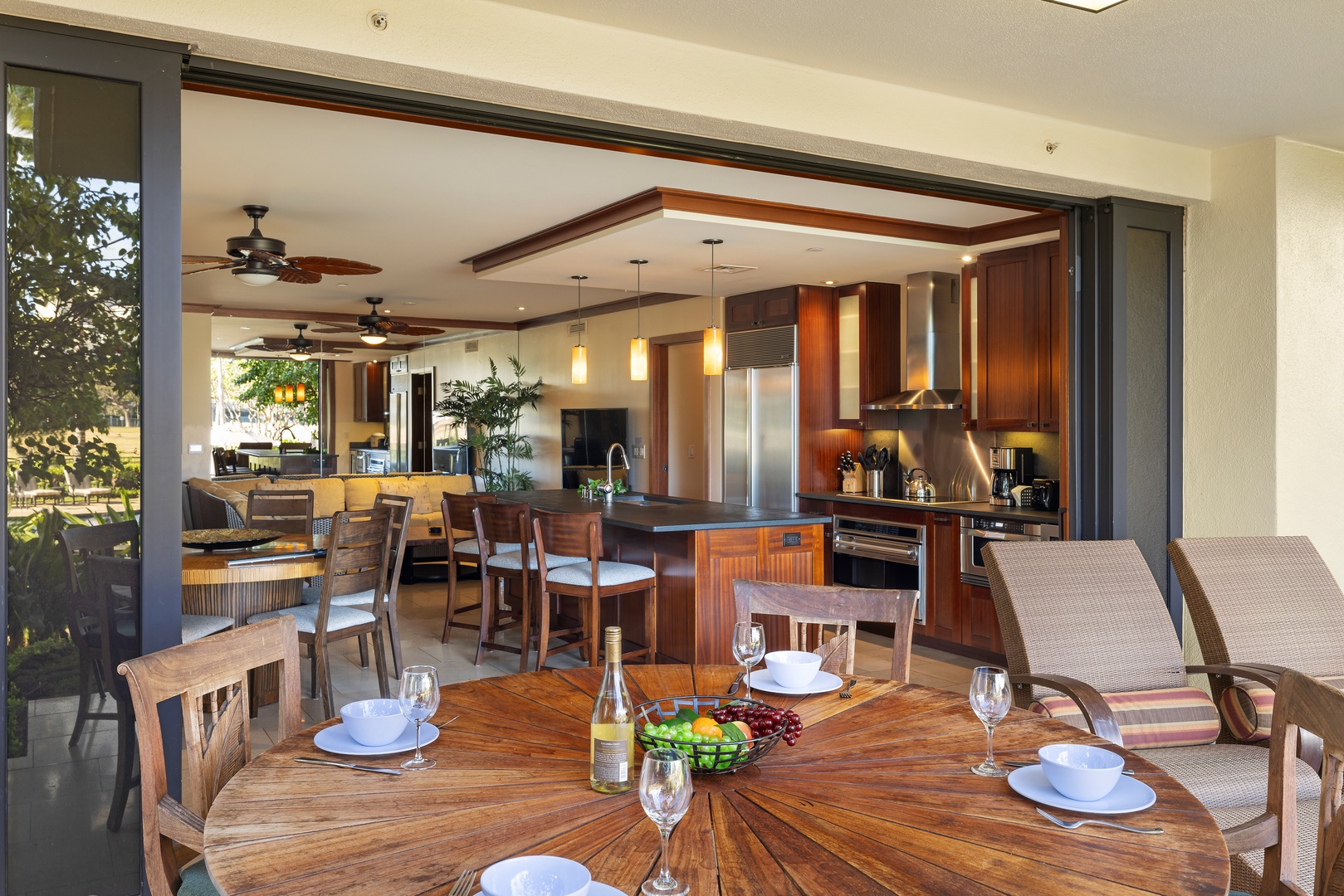 Kapolei Vacation Rentals, Ko Olina Beach Villas B107 - The spacious Kitchen with bar seating that opens to a large lanai.