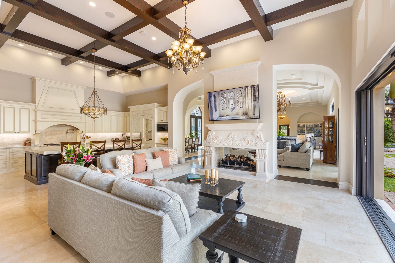 Honolulu Vacation Rentals, The Kahala Mansion Event Venue - Elegant living room with a fireplace, high ceilings, and beautiful architectural details for a luxurious yet welcoming ambiance.