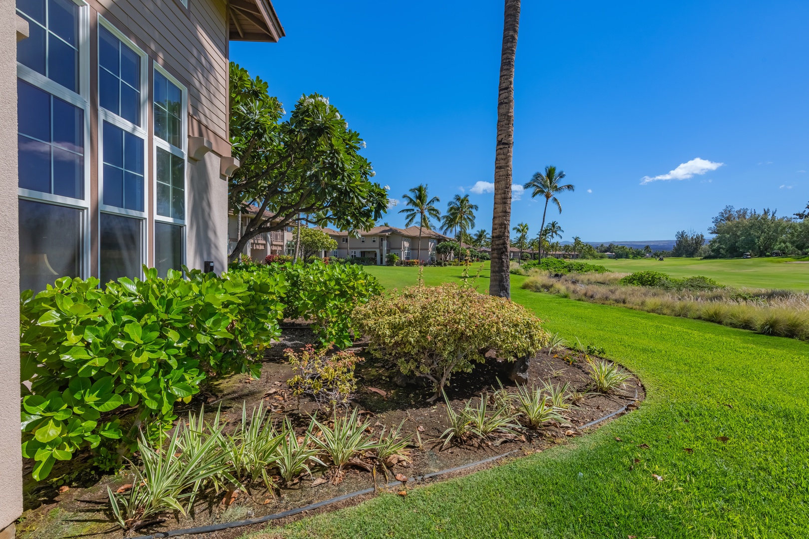 Waikoloa Vacation Rentals, Waikoloa Colony Villas 403 - Picturesque lanais framed by large windows overlooking vibrant landscapes.