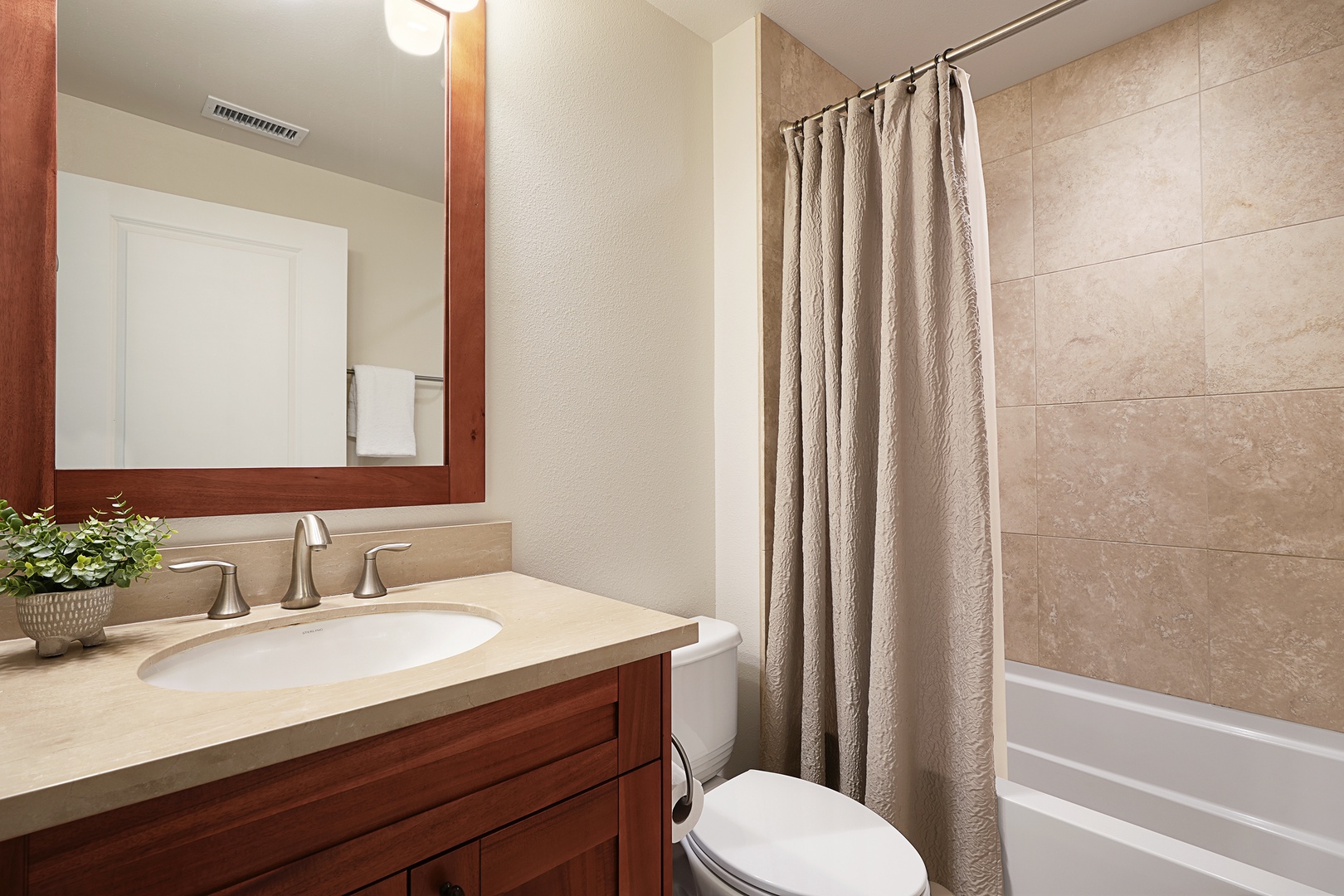 Koloa Vacation Rentals, Pili Mai 12A - Ensuite bathroom with shower/tub combo.