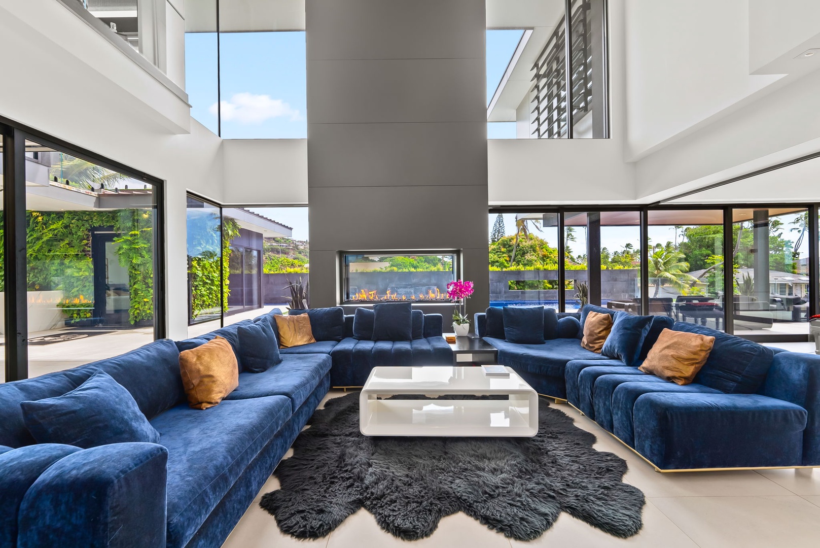 Honolulu Vacation Rentals, Ocean Villa Emilie - Framed by walls of glass, this luxurious lounge is made for morning espresso, sunset wine, and everything in between.