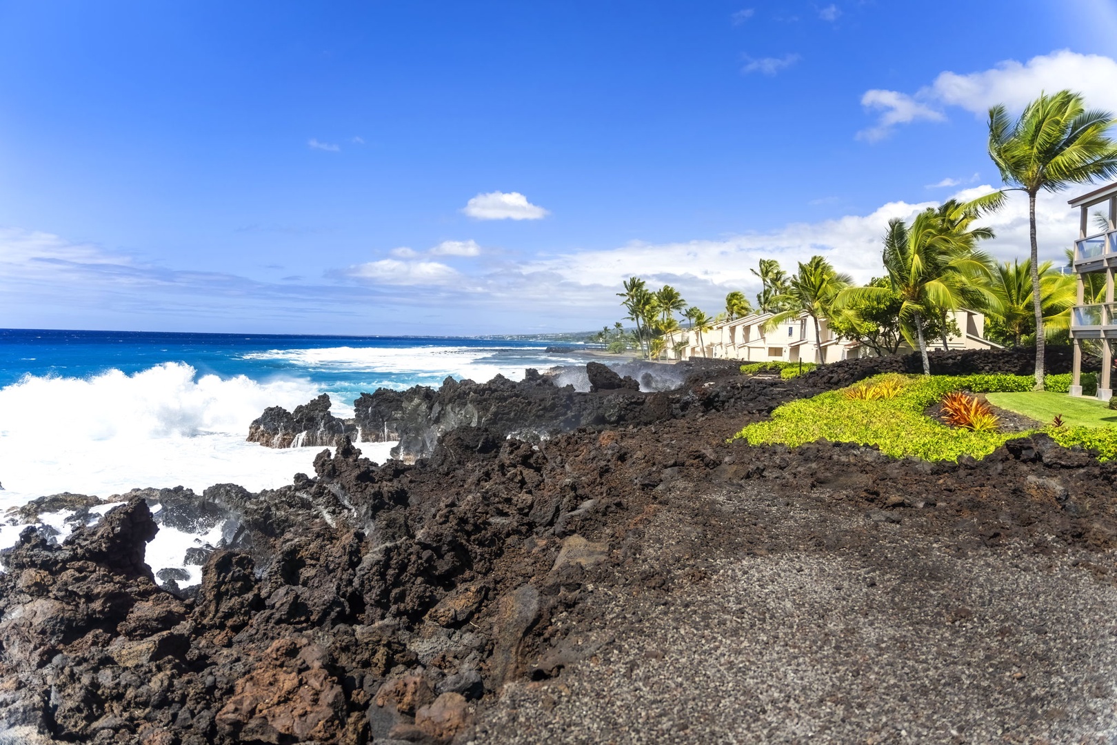 Kailua Kona Vacation Rentals, Keauhou Kona Surf & Racquet 1104 - The oceanfront opens wide here, blue running out to the horizon off the rocks.