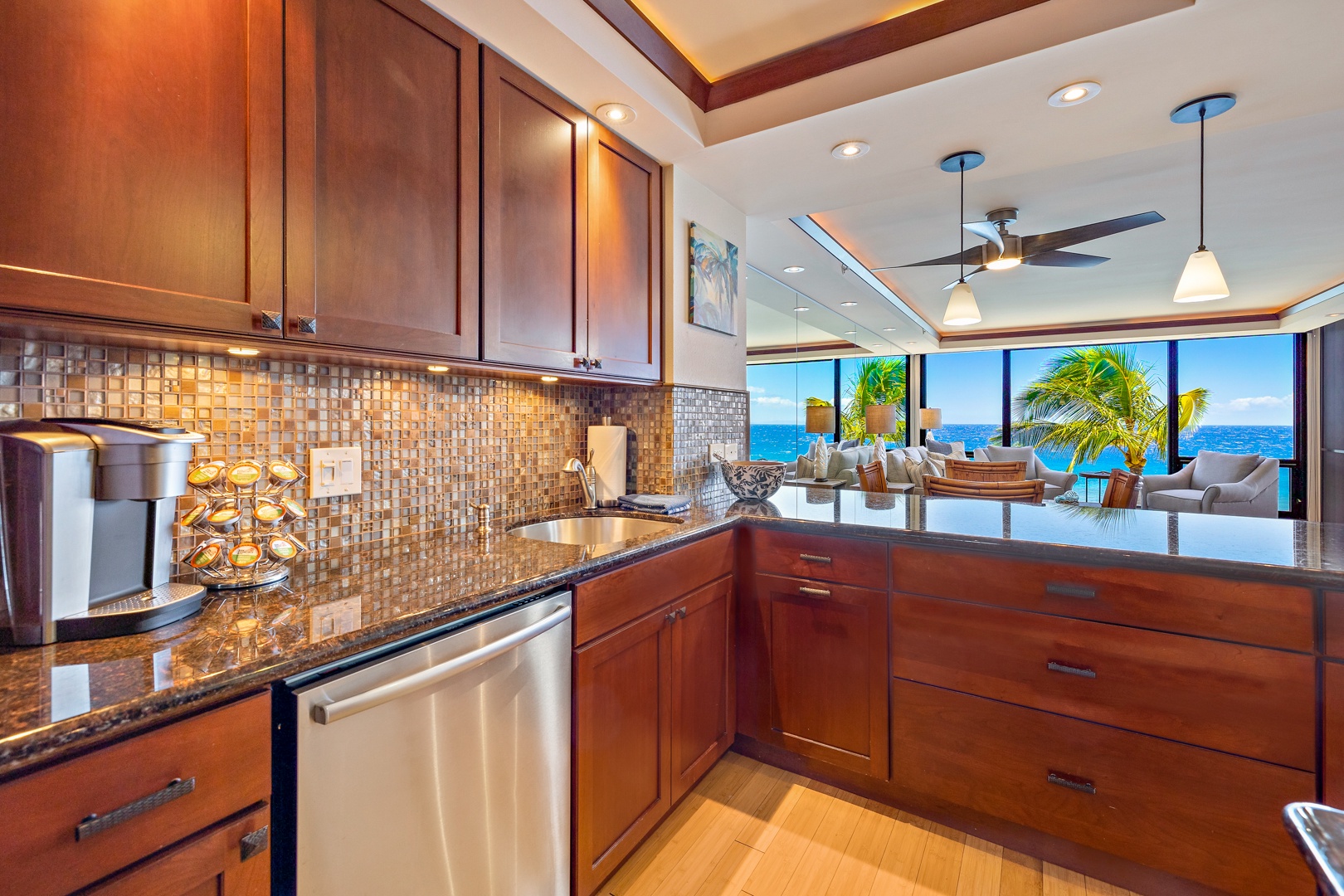 Lahaina Vacation Rentals, Mahana 608 - Kitchen with ocean views and modern finishes.