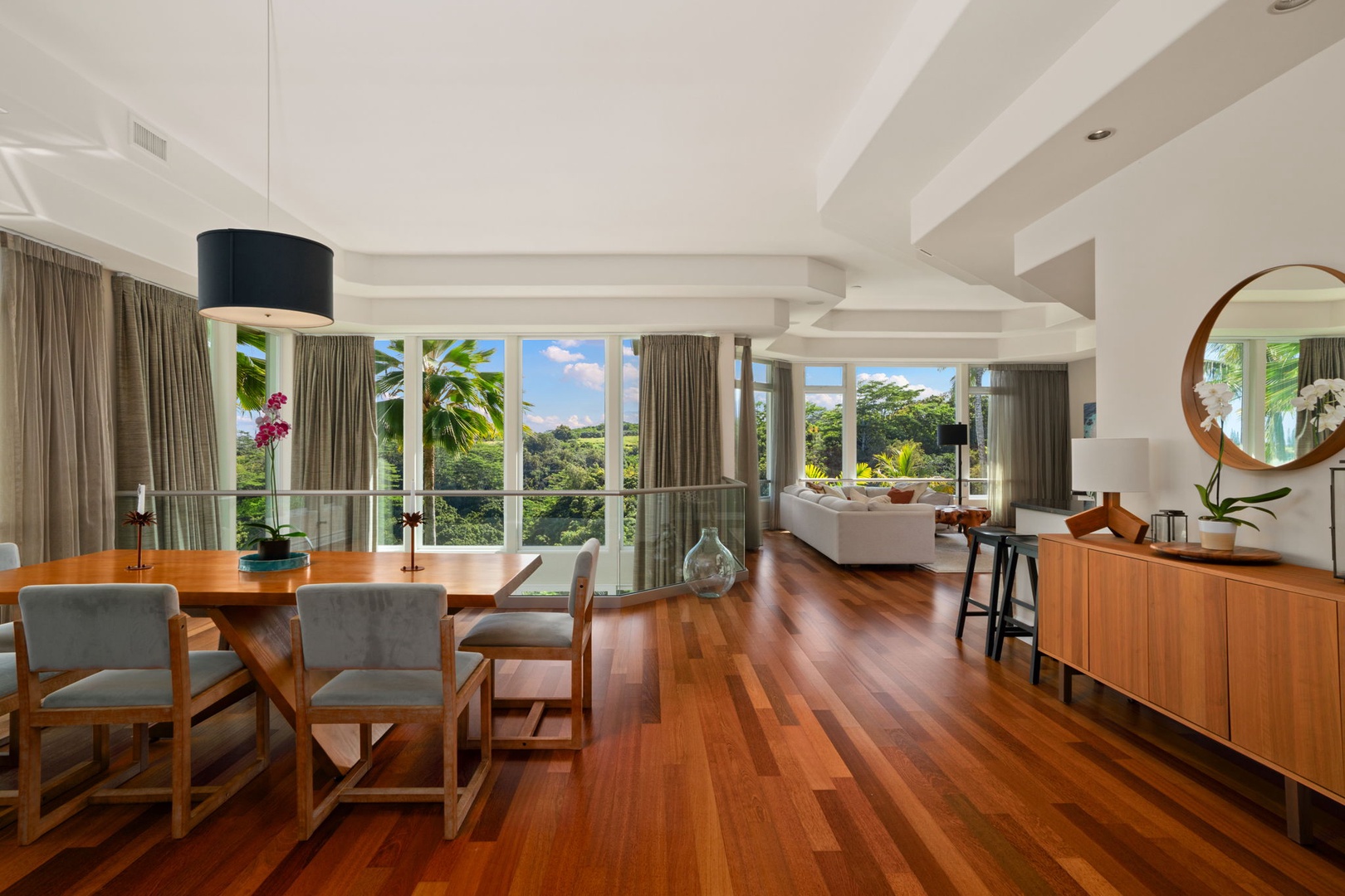Princeville Vacation Rentals, Kaiulani #8 - Gather for a meal at the dining table while the tropical landscape unfolds just beyond the windows.