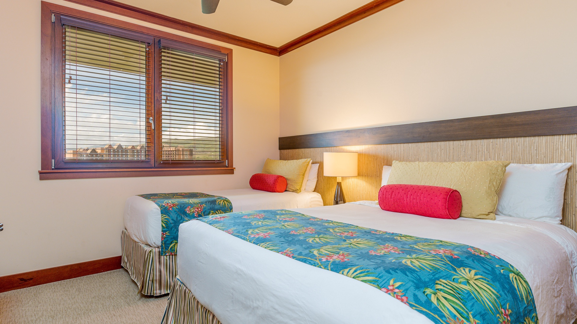 Kapolei Vacation Rentals, Ko Olina Beach Villas B1101 - The second guest bedroom with bright tropical patterns and soft lighting.