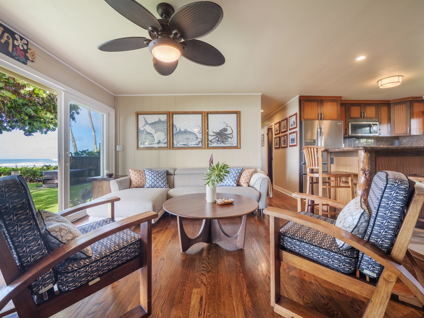 Haleiwa Vacation Rentals, Sunset Point Hawaiian Beachfront** - Living area with comfortable seats and warm and airy ambience.