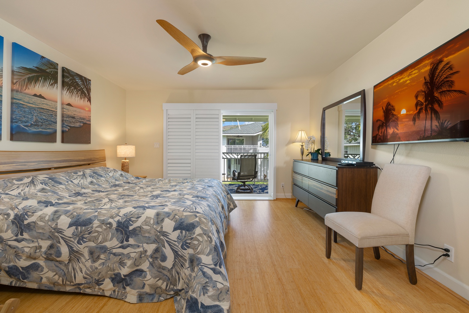 Kapolei Vacation Rentals, Ko Olina Kai 1083C - The upstairs primary guest bedroom with access to the lanai and ensuite bathroom and closet.